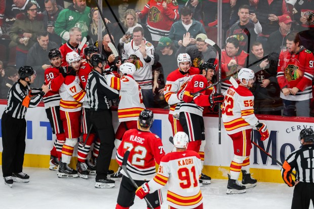 A scrum ensues between Blackhawks and Calgary Flames players during the third period, Nov. 18, 2025, at the United Center. (Dominic Di Palermo/Chicago Tribune)