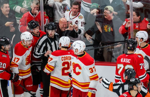 A scrum ensues between Blackhawks and Calgary Flames players during the third period, Nov. 18, 2025, at the United Center. (Dominic Di Palermo/Chicago Tribune)