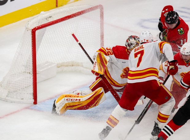 Blackhawks center Oliver Moore (11) scores bringing the Blackhawks up 4-2 during the third period against the Calgary Flames, Nov. 18, 2025, at the United Center. (Dominic Di Palermo/Chicago Tribune)