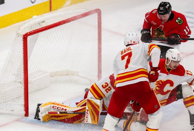 Blackhawks center Oliver Moore (11) scores bringing the Blackhawks up 4-2 during the third period against the Calgary Flames, Nov. 18, 2025, at the United Center. (Dominic Di Palermo/Chicago Tribune)