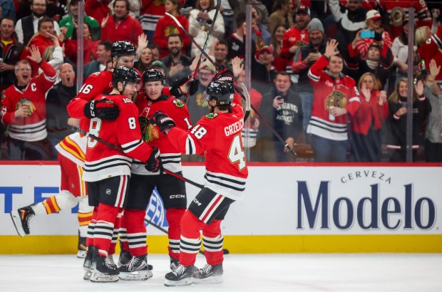 The Blackhawks celebrate center Ryan Donato's goal during the first period against the Calgary Flames, Nov. 18, 2025, at the United Center. (Dominic Di Palermo/Chicago Tribune)