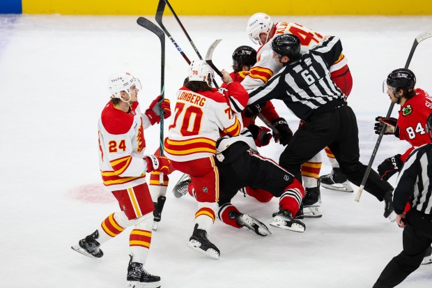 A scrum ensues between the Blackhawks and Calgary Flames within the last 30 seconds of the game during the third period, Nov. 18, 2025, at the United Center. (Dominic Di Palermo/Chicago Tribune)
