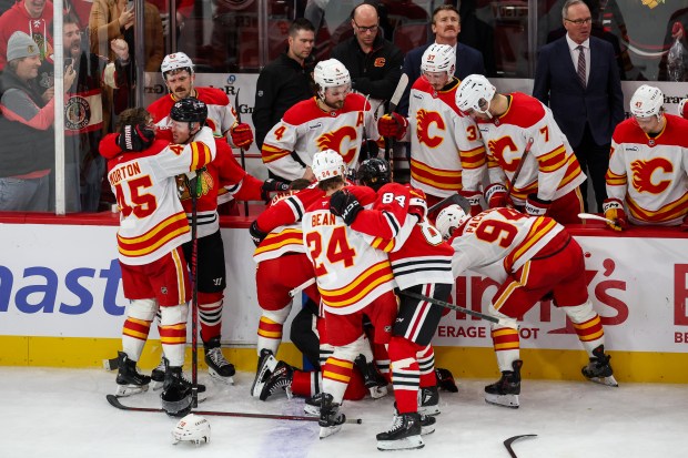 A scrum ensues between the Blackhawks and Calgary Flames within the last 30 seconds of the game during the third period, Nov. 18, 2025, at the United Center. (Dominic Di Palermo/Chicago Tribune)