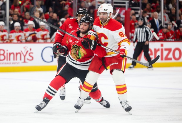 Blackhawks center Frank Nazar (91) and Flames center Nazem Kadri (91) defend each other during the first period, Nov. 18, 2025, at the United Center. (Dominic Di Palermo/Chicago Tribune)