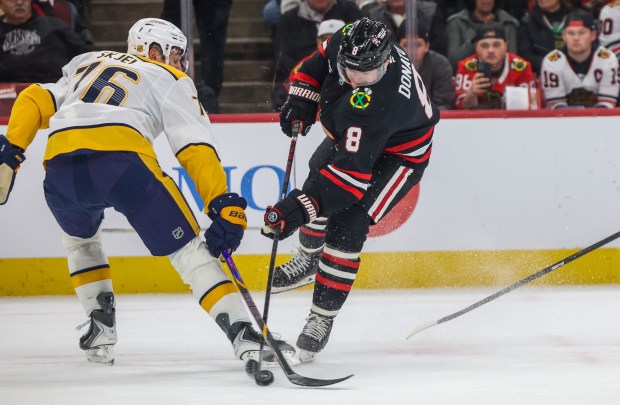 Blackhawks center Ryan Donato (8) shoots on goal and misses during the first period against the Nashville Predators, Nov. 28, 2025, at the United Center. (Dominic Di Palermo/Chicago Tribune)