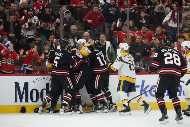 A scrum ensues between the Blackhawks and Nashville Predators during the second period, Nov. 28, 2025, at the United Center. (Dominic Di Palermo/Chicago Tribune)