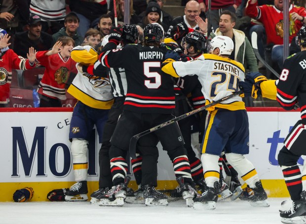 A scrum ensues between the Blackhawks and Nashville Predators during the second period, Nov. 28, 2025, at the United Center. (Dominic Di Palermo/Chicago Tribune)