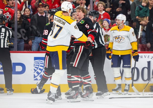 Nashville Predators right wing Michael McCarron (47) and Blackhawks defenseman Connor Murphy (5) shove each other while a scrum ensues between the Blackhawks and Nashville Predators during the second period, Nov. 28, 2025, at the United Center. (Dominic Di Palermo/Chicago Tribune)