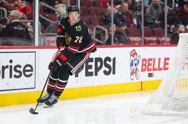 Blackhawks defenseman Alex Vlasic handles the puck during the second period against the Nashville Predators, Nov. 28, 2025, at the United Center. (Dominic Di Palermo/Chicago Tribune)