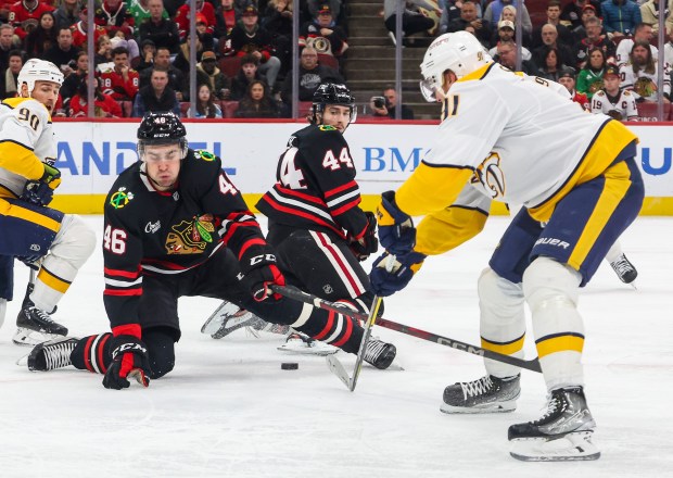 Blackhawks defenseman Louis Crevier (46) tries to block a pass by Nashville Predators center Steven Stamkos (91) during the second period, Nov. 28, 2025, at the United Center. (Dominic Di Palermo/Chicago Tribune)