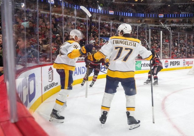 Nashville Predators center Steven Stamkos (91) and right wing Luke Evangelista (77) celebrate Stamkos' goal that brought the Predators to 2-1 during the second period against the Blackhawks, Nov. 28, 2025, at the United Center. (Dominic Di Palermo/Chicago Tribune)