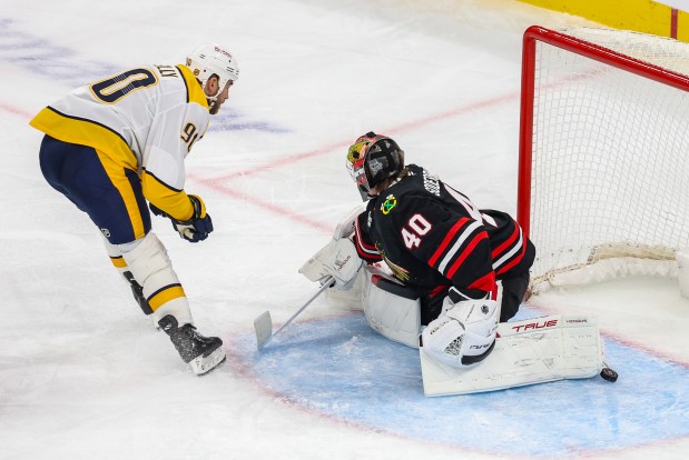 Nashville Predators center Ryan O'Reilly (90) scores a goal past Blackhawks goaltender Arvid Soderblom (40) bringing the score to 4-2 during the third period against the Blackhawks, Nov. 28, 2025, at the United Center. (Dominic Di Palermo/Chicago Tribune)