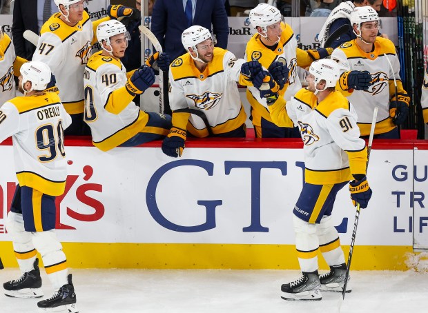 Nashville Predators center Steven Stamkos (91) celebrates his goal with his teammates on the bench during the third period against the Blackhawks, Nov. 28, 2025, at the United Center. (Dominic Di Palermo/Chicago Tribune)