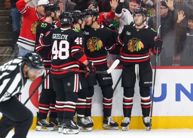 The Blackhawks celebrate Blackhawks center Ryan Donato's goal that brought the score 1-0 during the first period against the Nashville Predators, Nov. 28, 2025, at the United Center. (Dominic Di Palermo/Chicago Tribune)