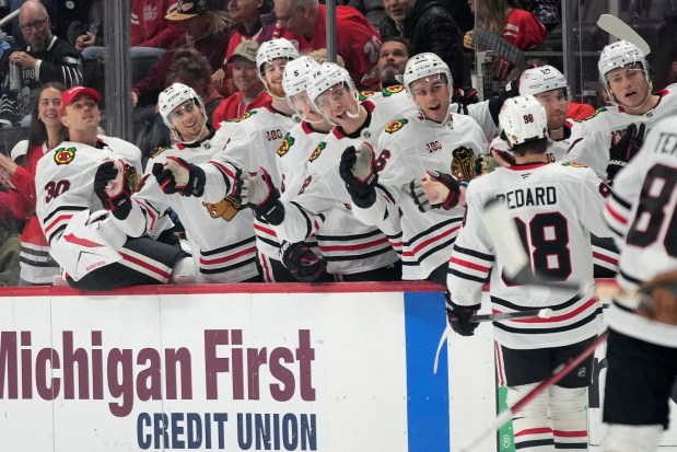 Blackhawks center Connor Bedard celebrates with the bench after scoring during the first period against the Red Wings on Sunday, Nov. 9, 2025, in Detroit. (AP Photo/Ryan Sun)