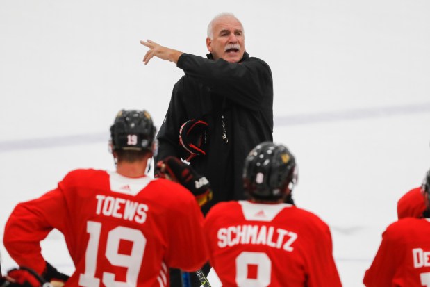 Chicago Blackhawks head coach Joel Quenneville talks to the team at the first practice of camp held at MB Ice Arena in Chicago on Sept. 14, 2018. (José M. Osorio/Chicago Tribune)