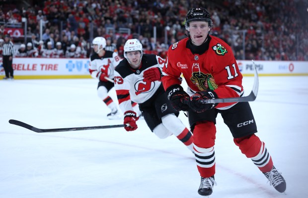 Blackhawks center Oliver Moore skates after the puck in the first period against the Devils on Wednesday, Nov. 12, 2025, at the United Center. (Chris Sweda/Chicago Tribune)