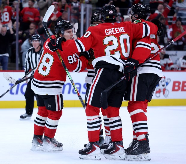 Blackhawks center Connor Bedard (98) celebrates with his teammates after scoring a goal in the first period against the Devils on Wednesday, Nov. 12, 2025, at the United Center. (Chris Sweda/Chicago Tribune)