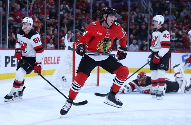 Blackhawks center Sam Lafferty starts to celebrate after scoring a goal in the third period against the Devils on Wednesday, Nov. 12, 2025, at the United Center. (Chris Sweda/Chicago Tribune)