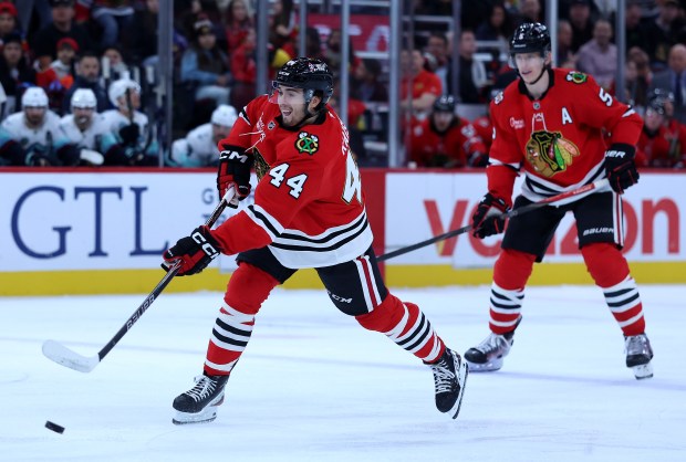 Chicago Blackhawks defenseman Wyatt Kaiser (44) takes a shot in the first period of a game against the Seattle Kraken at the United Center in Chicago on Nov. 20, 2025. (Chris Sweda/Chicago Tribune)