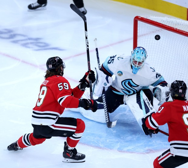 Chicago Blackhawks left wing Tyler Bertuzzi (59) scores a goal on Seattle Kraken goaltender Joey Daccord (35) in the second period of a game at the United Center in Chicago on Nov. 20, 2025. (Chris Sweda/Chicago Tribune)