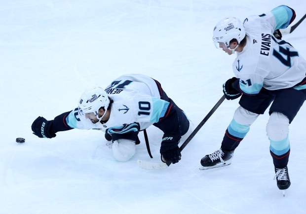 Seattle Kraken center Matty Beniers (10) plays some defense without his stick in the second period of a game against the Chicago Blackhawks at the United Center in Chicago on Nov. 20, 2025. (Chris Sweda/Chicago Tribune)