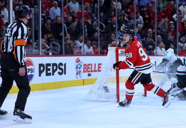 Chicago Blackhawks center Connor Bedard (98) argues with a referee after Bedard thought he was interfered with on a play in the third period of a game against the Seattle Kraken at the United Center in Chicago on Nov. 20, 2025. The referees called an unsportsmanlike conduct on Bedard for arguing the call. (Chris Sweda/Chicago Tribune)