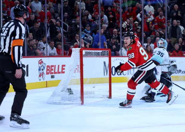 Chicago Blackhawks center Connor Bedard (98) argues with a referee after Bedard thought he was interfered with on a play in the third period of a game against the Seattle Kraken at the United Center in Chicago on Nov. 20, 2025. The referees called an unsportsmanlike conduct on Bedard for arguing the call. (Chris Sweda/Chicago Tribune)
