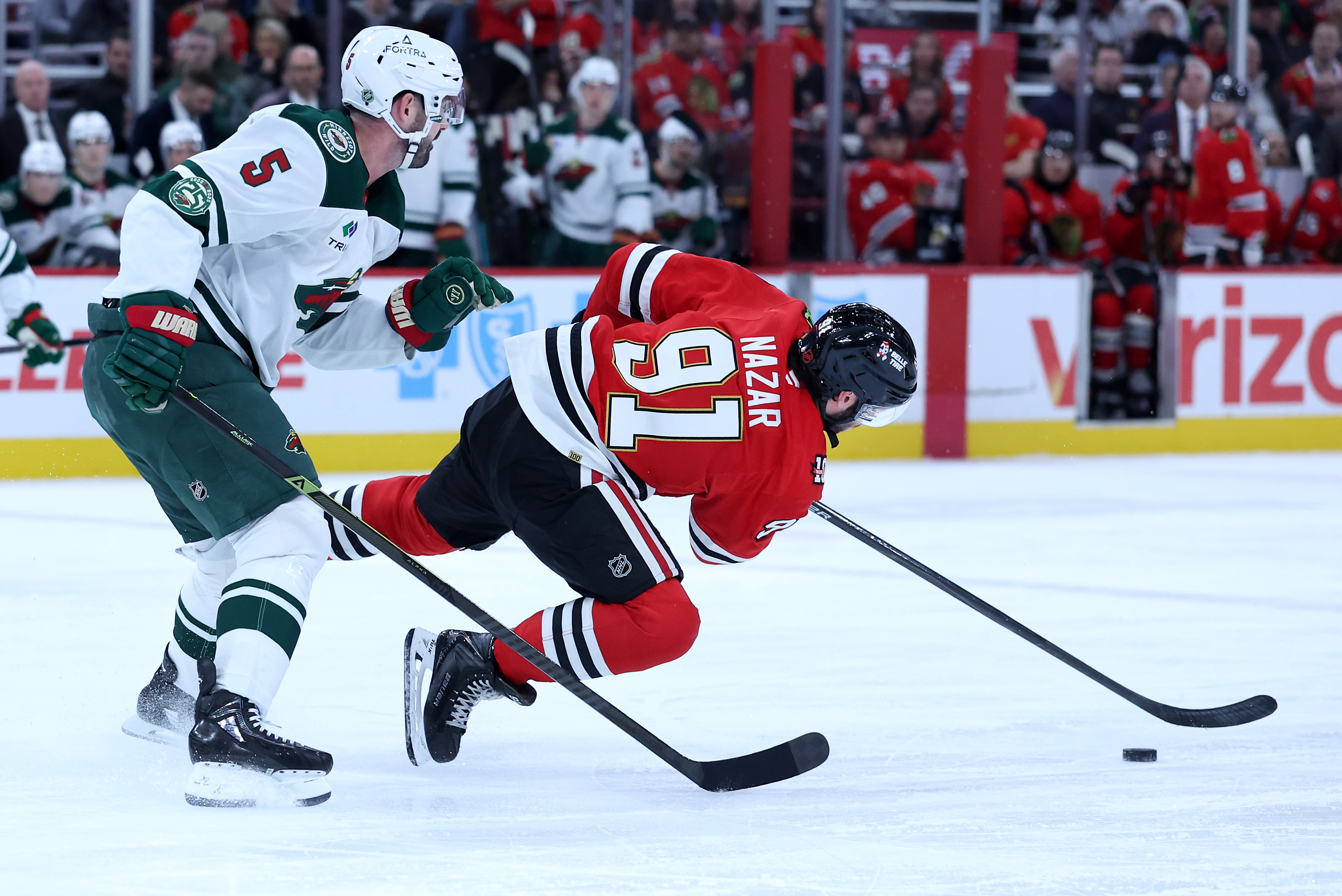 Chicago Blackhawks center Frank Nazar (91) falls to the ice in the first period of a game against the Minnesota Wild at the United Center in Chicago on Nov. 26, 2025. (Chris Sweda/Chicago Tribune)