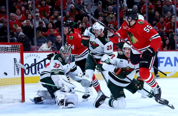 Chicago Blackhawks defenseman Artyom Levshunov (55) scores a goal on Minnesota Wild goaltender Filip Gustavsson (32) in the third period of a game at the United Center in Chicago on Nov. 26, 2025. (Chris Sweda/Chicago Tribune)