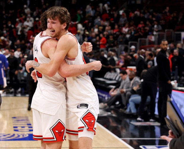 Chicago Bulls guard Josh Giddey and forward Matas Buzelis (right) celebrate after a victory over the Philadelphia 76ers at the United Center in Chicago on Nov. 4, 2025. (Chris Sweda/Chicago Tribune)