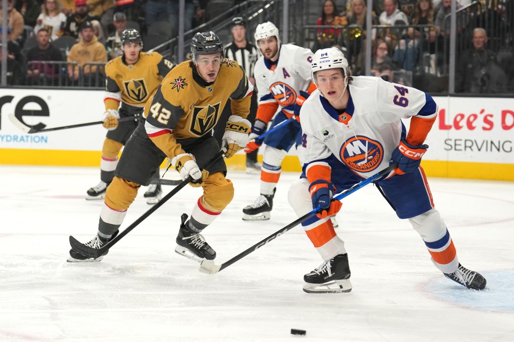 Cal Ritchie (right) and Braeden Bowman (left) battle for the puck during the Rangers' overtime loss to the Golden Knights on Nov. 13, 2025.