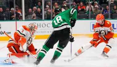 Dallas Stars goaltender Jake Oettinger (29) gloves a shot from Anaheim Ducks' Ryan Poehling (25) as Colin Blackwell (15) helps defend on the play in the second period of an NHL hockey game Thursday, Nov. 6, 2025, in Dallas. (AP Photo/Tony Gutierrez)