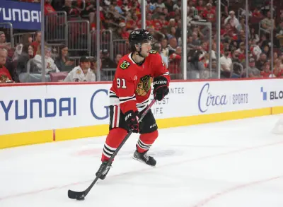 Oct 3, 2025; Chicago, Illinois, USA; Chicago Blackhawks center Frank Nazar (91) skates with the puck during the first period against the Minnesota Wild at United Center.