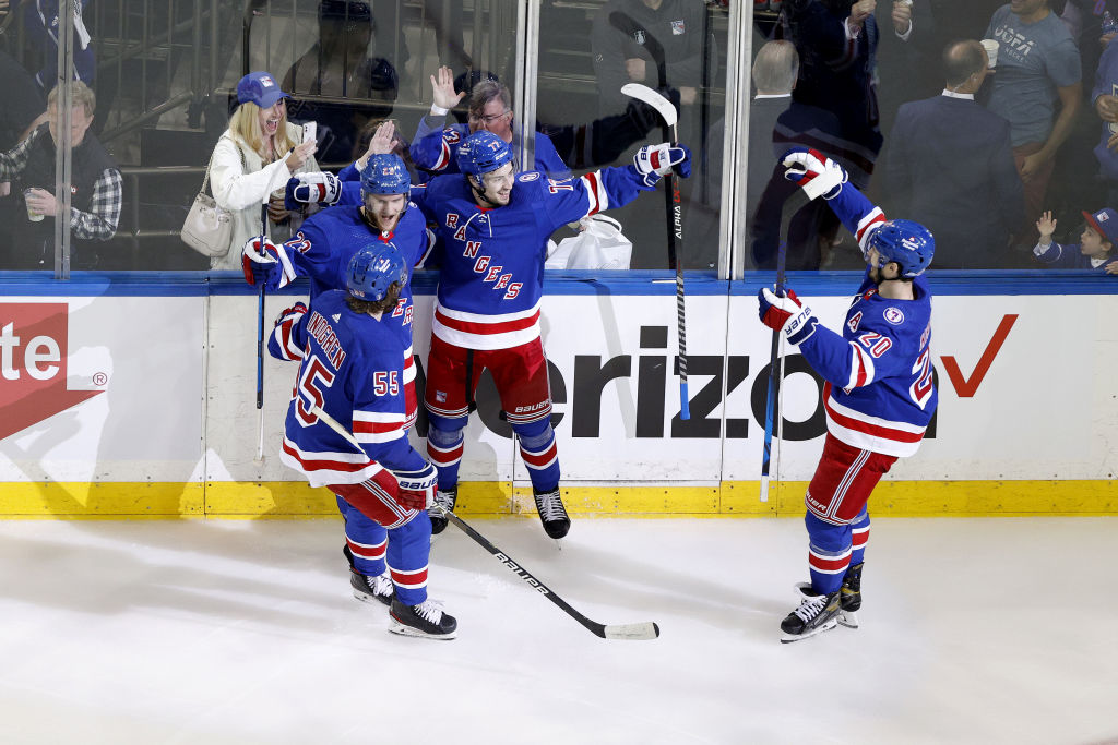 NEW YORK, NEW YORK - JUNE 01: Frank Vatrano #77 of the New York Rangers celebrates with his teammates Adam Fox #23, Ryan Lindgren #55 and Chris Kreider #20 after scoring a goal on Andrei Vasilevskiy #88 of the Tampa Bay Lightning during the second period in Game One of the Eastern Conference Final of the 2022 Stanley Cup Playoffs at Madison Square Garden on June 01, 2022 in New York City. (Photo by Sarah Stier/Getty Images)