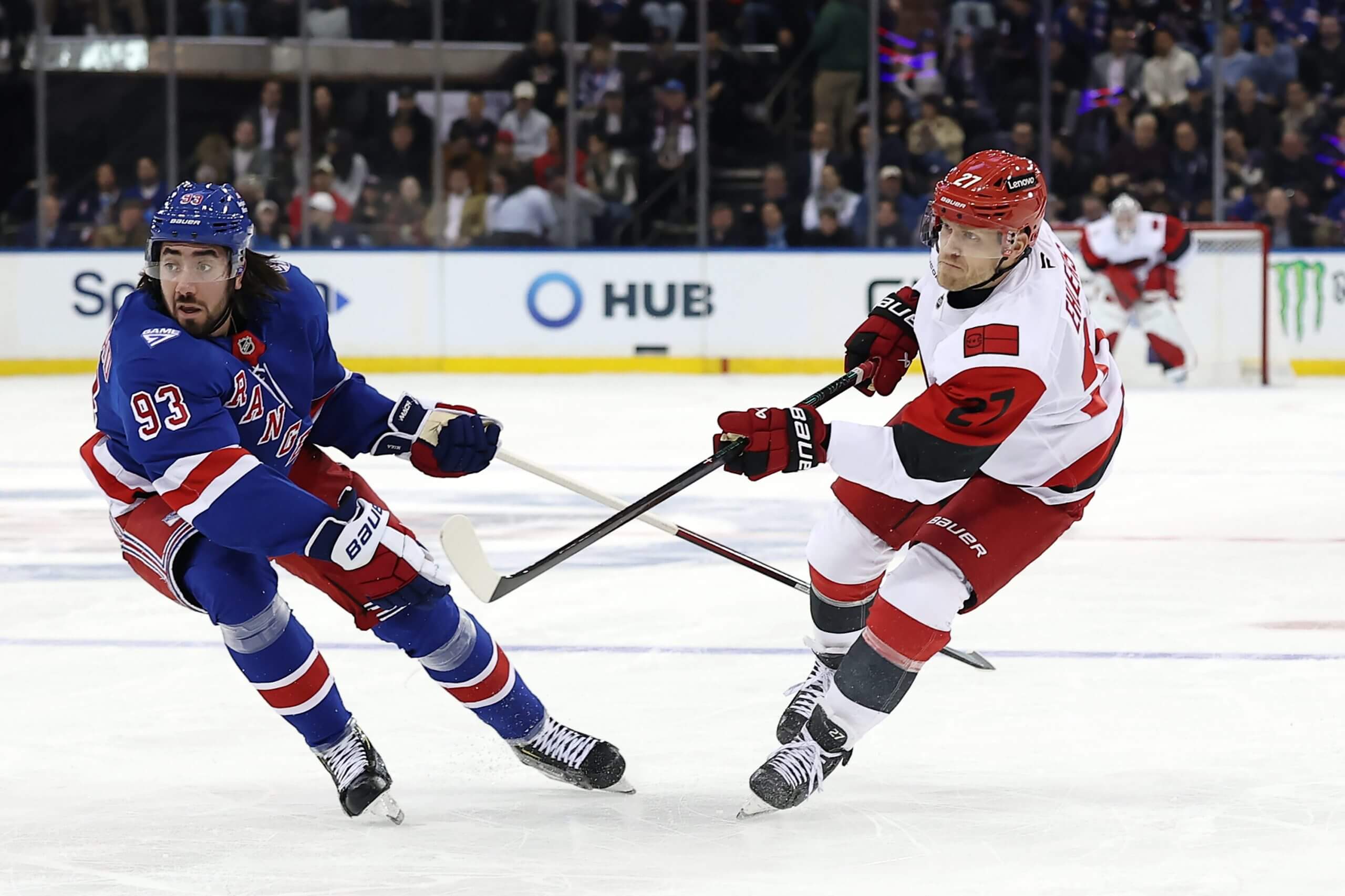 Nikolaj Ehlers shoots the puck past Mika Zibanejad.