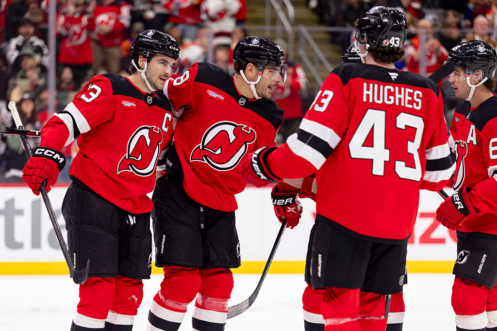NEWARK, NEW JERSEY - NOVEMBER 10 : Timo Meier #28 of the New Jersey Devils (center) celebrates with teammate Nico Hischier #13 (left) after scoring a goal during the first period of the NHL regular season game against the New York Islanders at the Prudential Center on November 10, 2025 in Newark, New Jersey. (Photo by Andrew Maclean/NHLI via Getty Images)