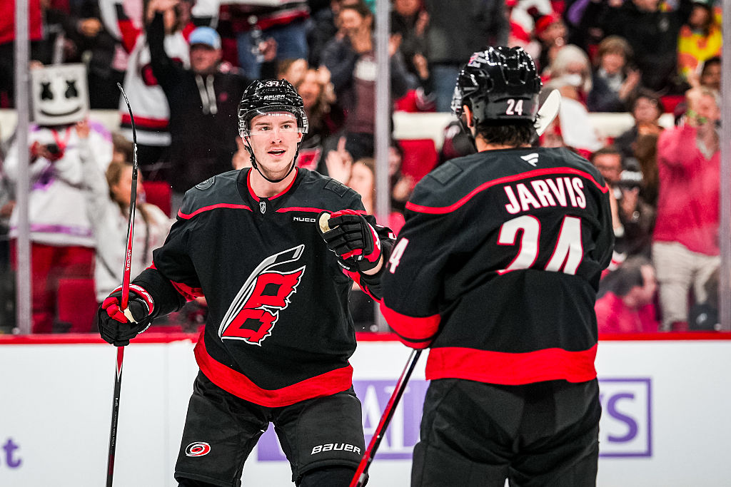 RALEIGH, NORTH CAROLINA - NOVEMBER 14: Andrei Svechnikov #37 of the Carolina Hurricanes celebrates with Seth Jarvis #24 after scoring a goal during the first period against the Vancouver Canucks at Lenovo Center on November 14, 2025 in Raleigh, North Carolina. (Photo by Josh Lavallee/NHLI via Getty Images)