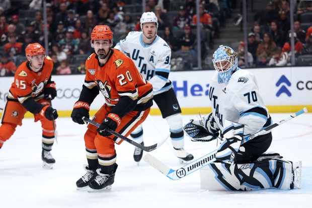 The Ducks’ Chris Kreider (20) looks for a pass as...