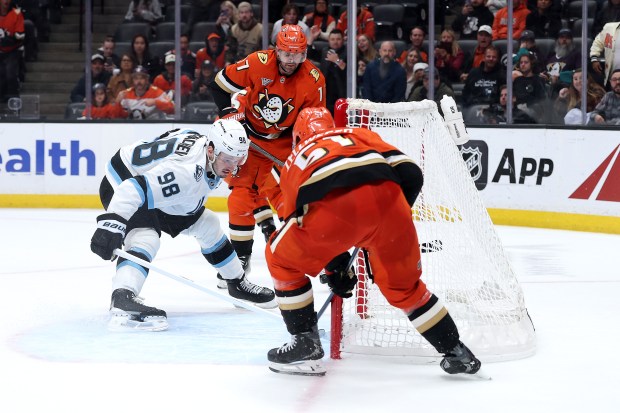 The Utah Mammoth’s Mikhail Sergachev, left, is unable to block...