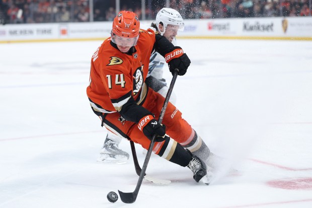 The Ducks’ Drew Helleson controls the puck during the third...