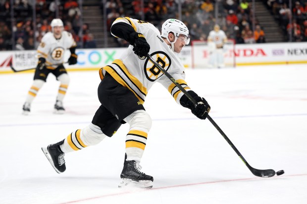 The Boston Bruins’ Tanner Jeannot shoots the puck during the...