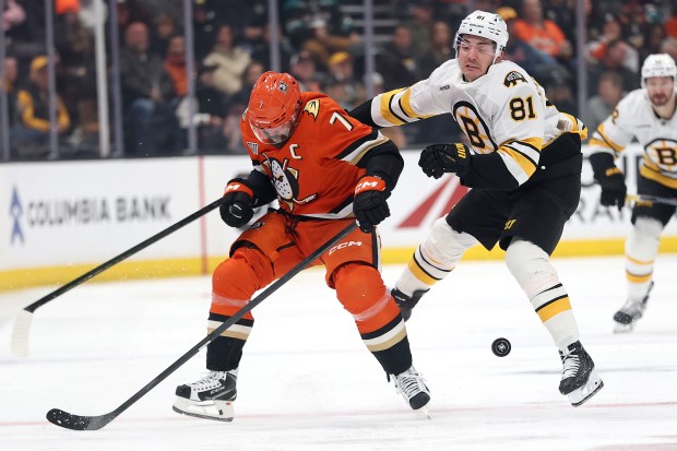 The Ducks’ Radko Gudas, left, collides with the Boston Bruins’...