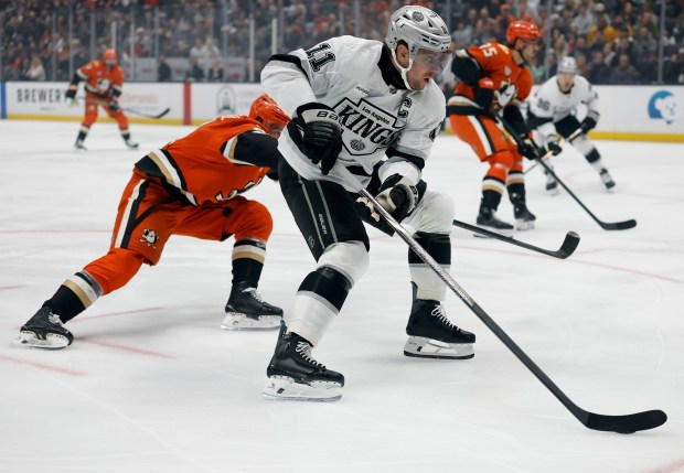 Kings captain Anze Kopitar skates in for a shot past...