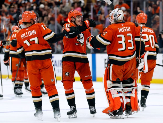 The Ducks’ Alex Killorn (17) and Pavel Mintyukov (98) celebrate...