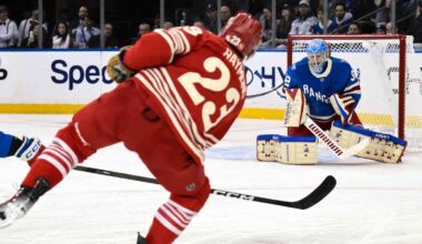 Brad Marchand, Sam Reinhart, Aaron Ekblad and Sergei Bobrovsky on one side, Connor McDavid, Leon Draisaitl, Evan Bouchard and Stuart Skinner on other side, Stanley Cup in middle, hockey rink in background