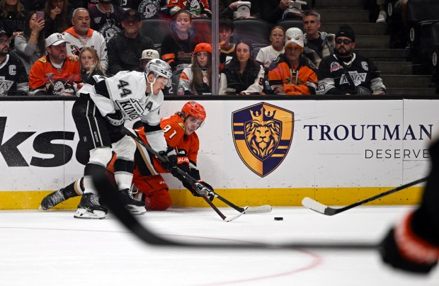 The Ducks’ Leo Carlsson, right, and the Kings’ Mikey Anderson...