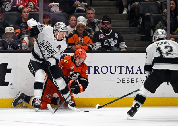 The Ducks’ Leo Carlsson (91) and the Kings’ Jacob Moverare...