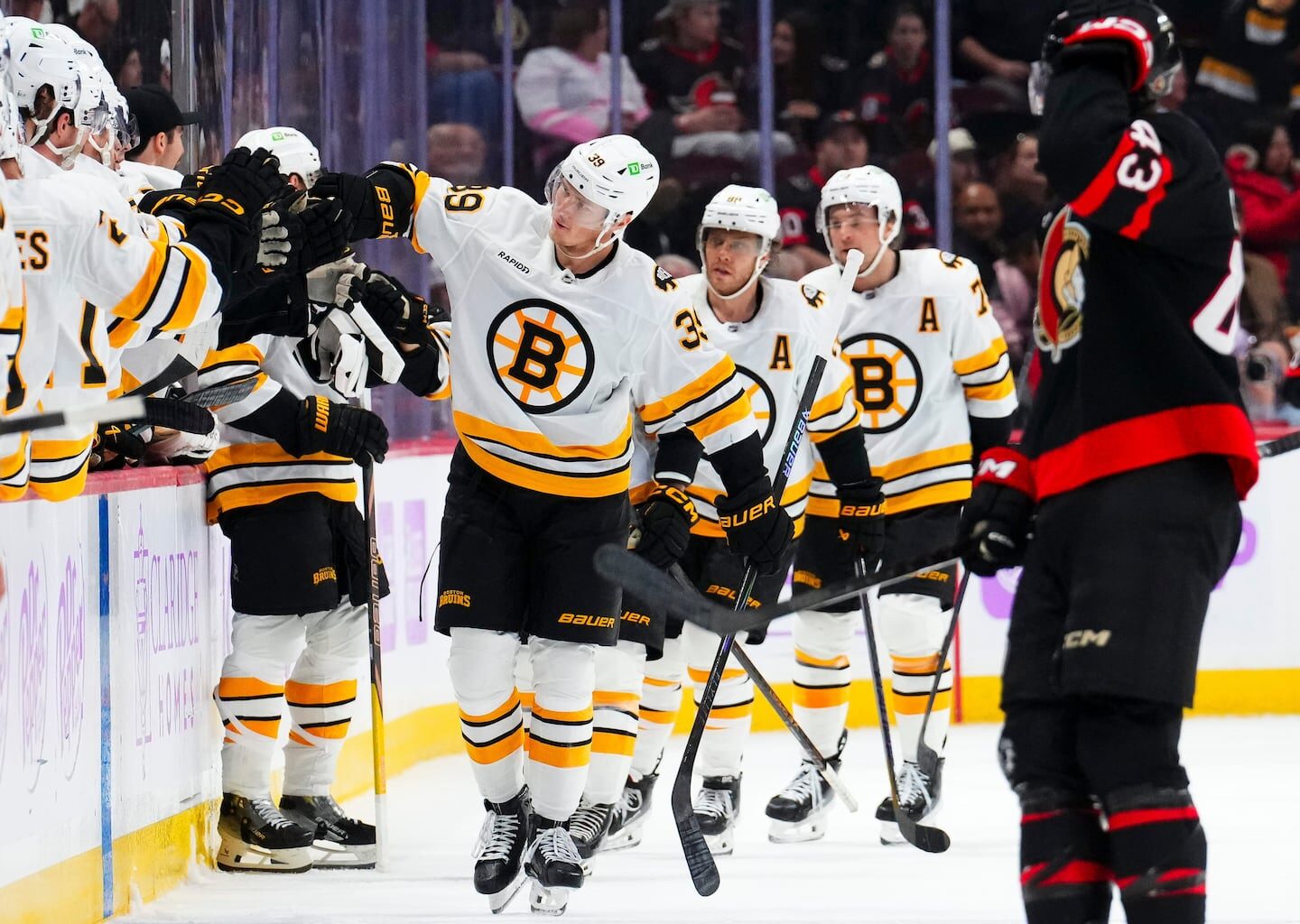 Morgan Geekie and his Bruins teammates have added a special touch to the line of fist bumps at the bench after scoring a goal.