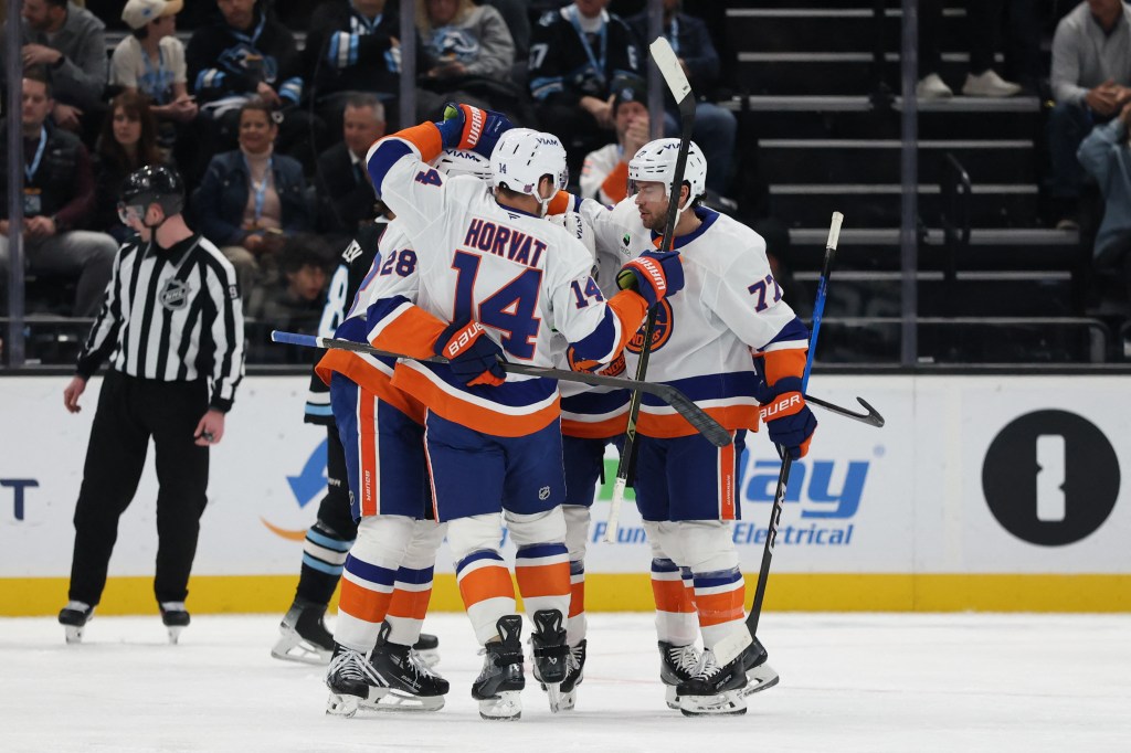 The New York Islanders celebrate a goal by left wing Emil Heineman (51) against the Utah Mammoth during the first period at Delta Center. 